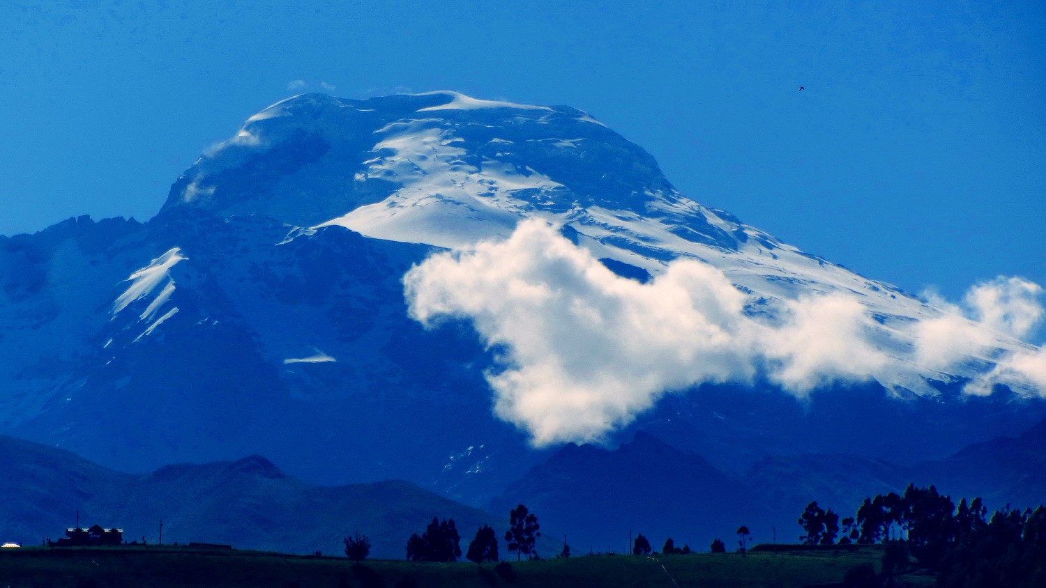 Volcan Cayambe seen from the village Cayambe